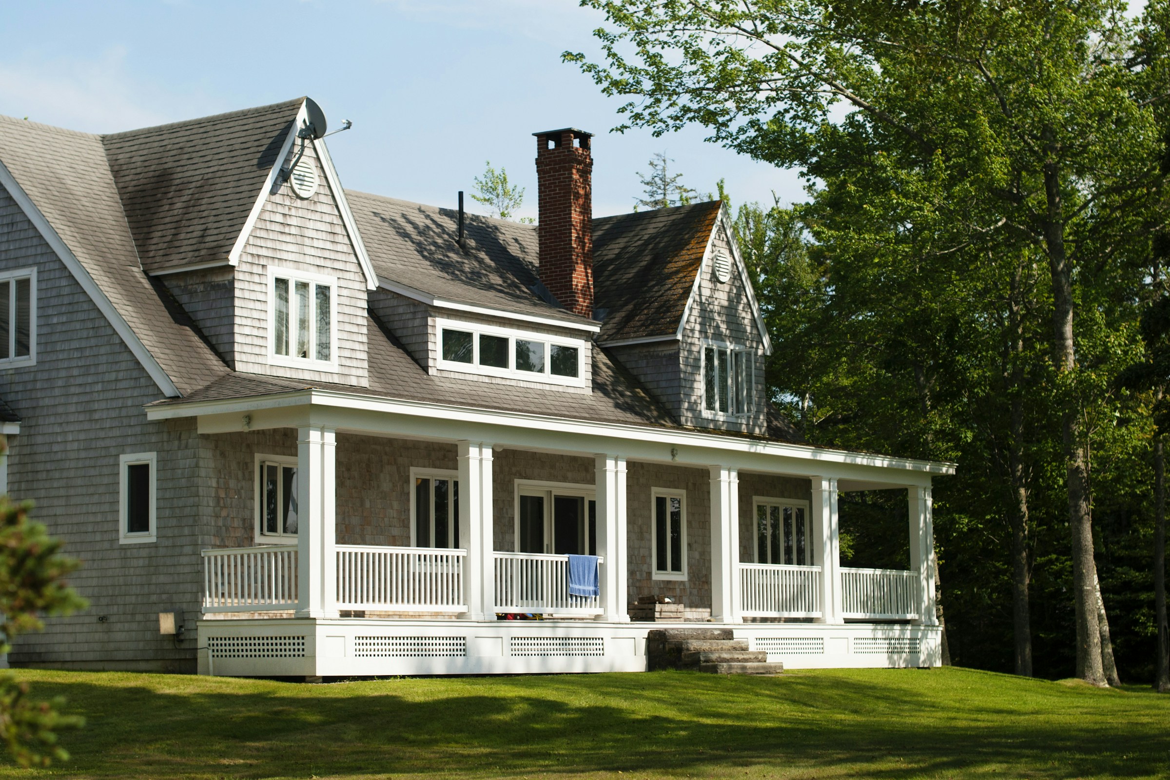 Residential home surrounded by green trees